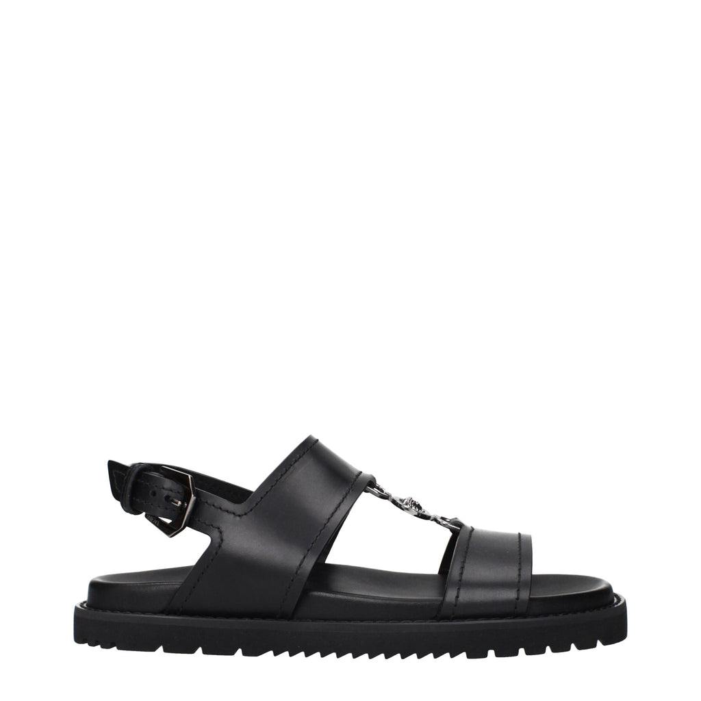 Versace Flache Sandalen aus schwarzem Leder
