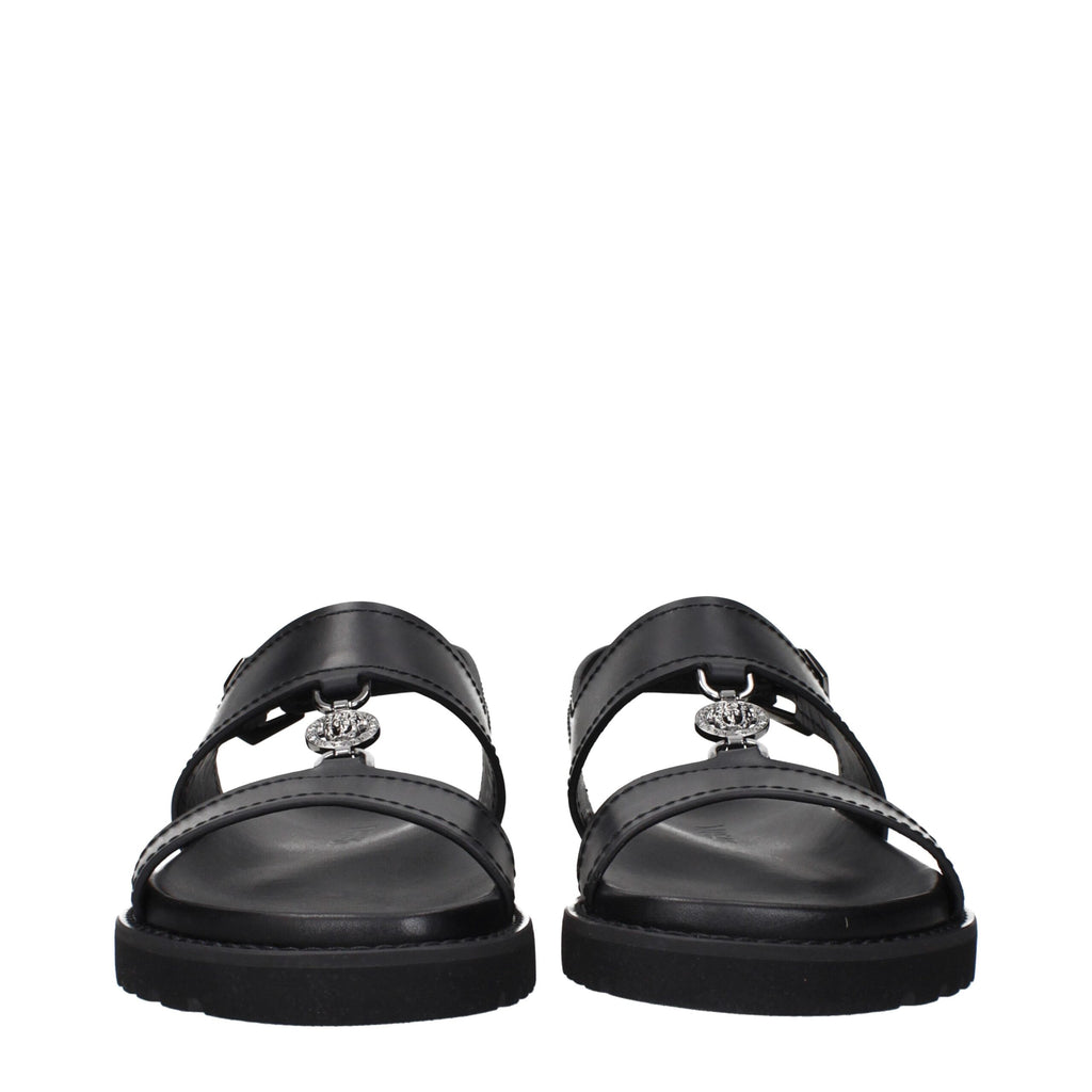 Versace Flache Sandalen aus schwarzem Leder
