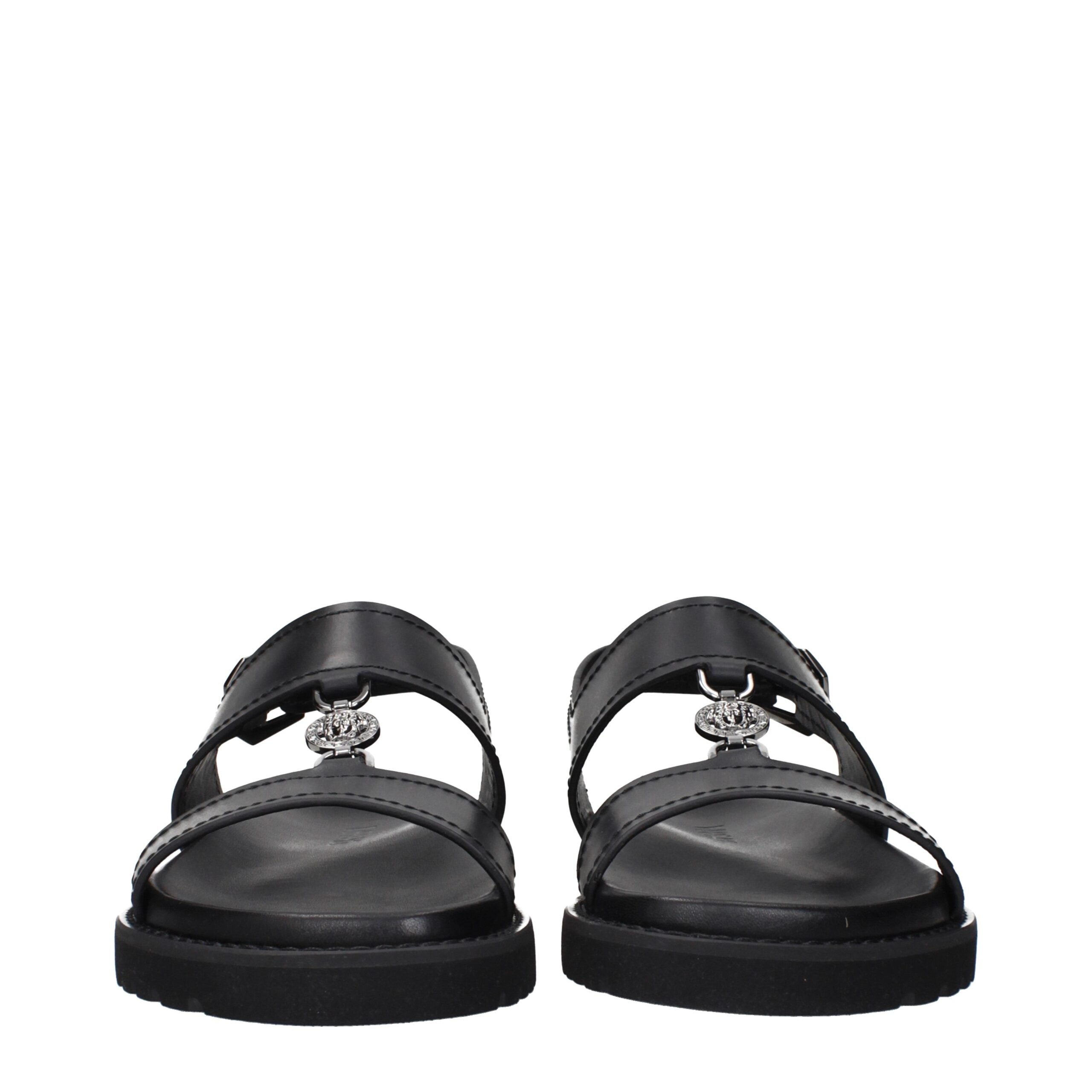 Versace Flache Sandalen aus schwarzem Leder